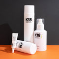 A range of K18 products with a black background