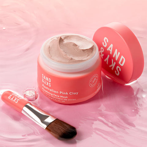 Open tub of Sand & Sky Australian Pink Clay Porefining Face Mask 60g with lid and application brush